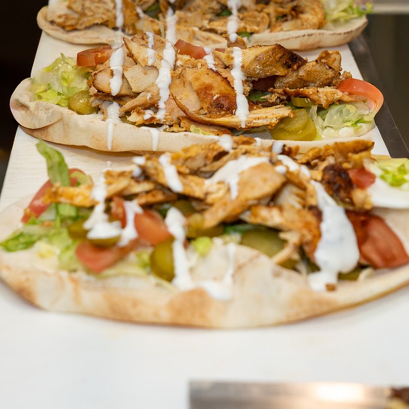 8 chicken shawarma sandwiches with sauce .jpg
