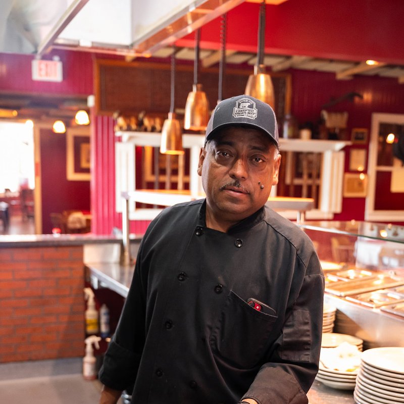 Chef Holding Steak on Plate.jpg