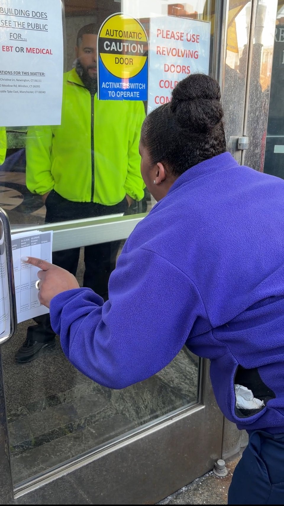 Tamir Capehart attempts to deliver grievances while security guards refuse access to DSS building.