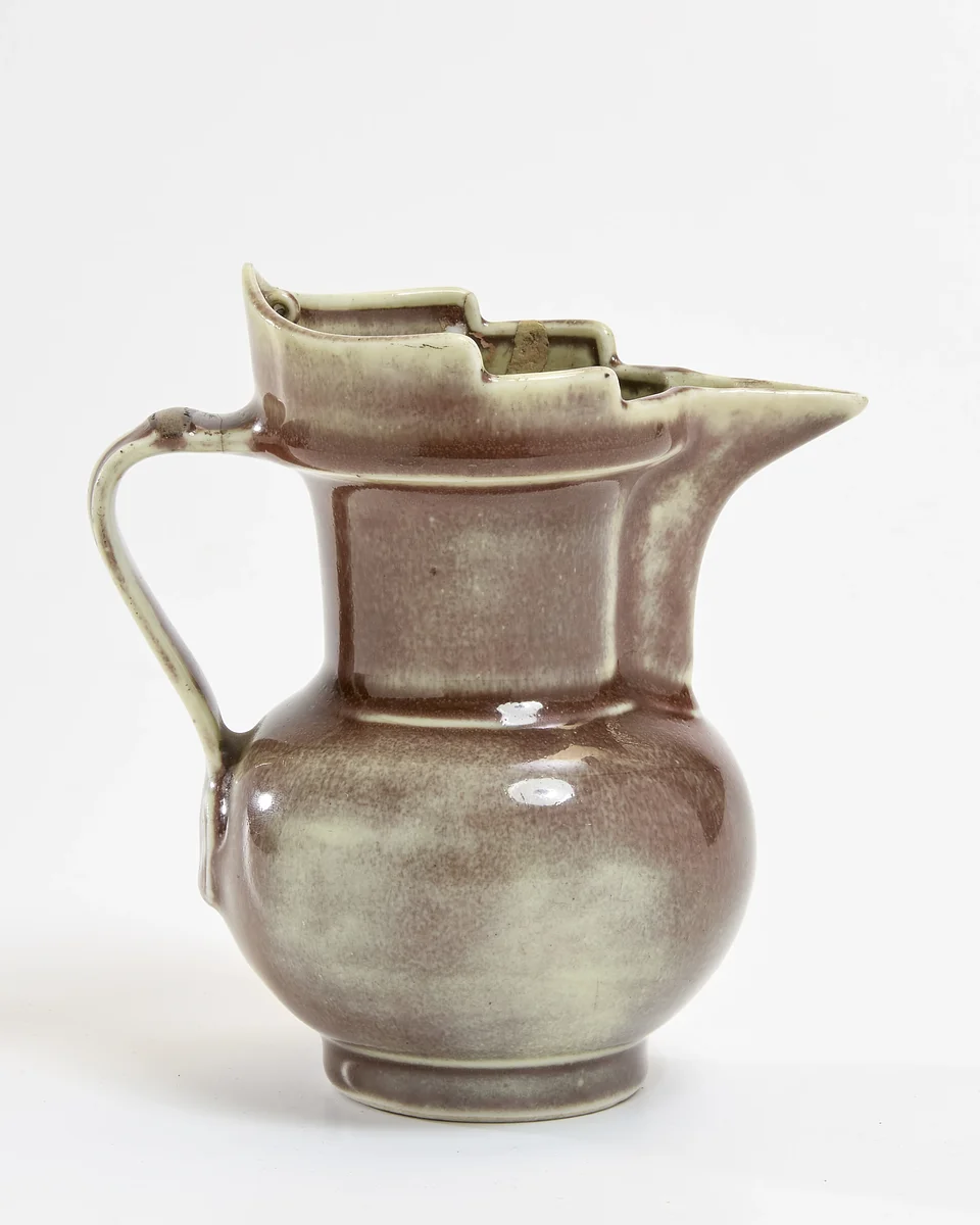 A Chinese copper-red-glazed 'monks' cap' ewer, Late Qing dynasty, apocryphal Xuande mark
Price Realised: £13,120
