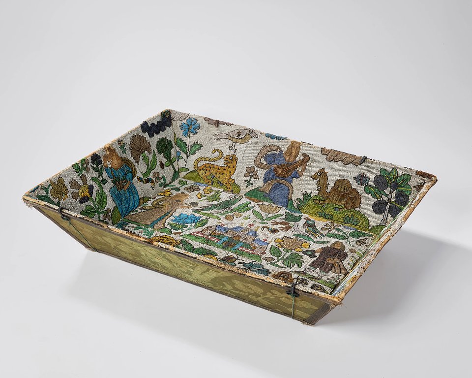 Lot 144: A Charles II beadwork basket, c.1660, worked in coloured beads mounted on wood boards
Price Realised: £21,648