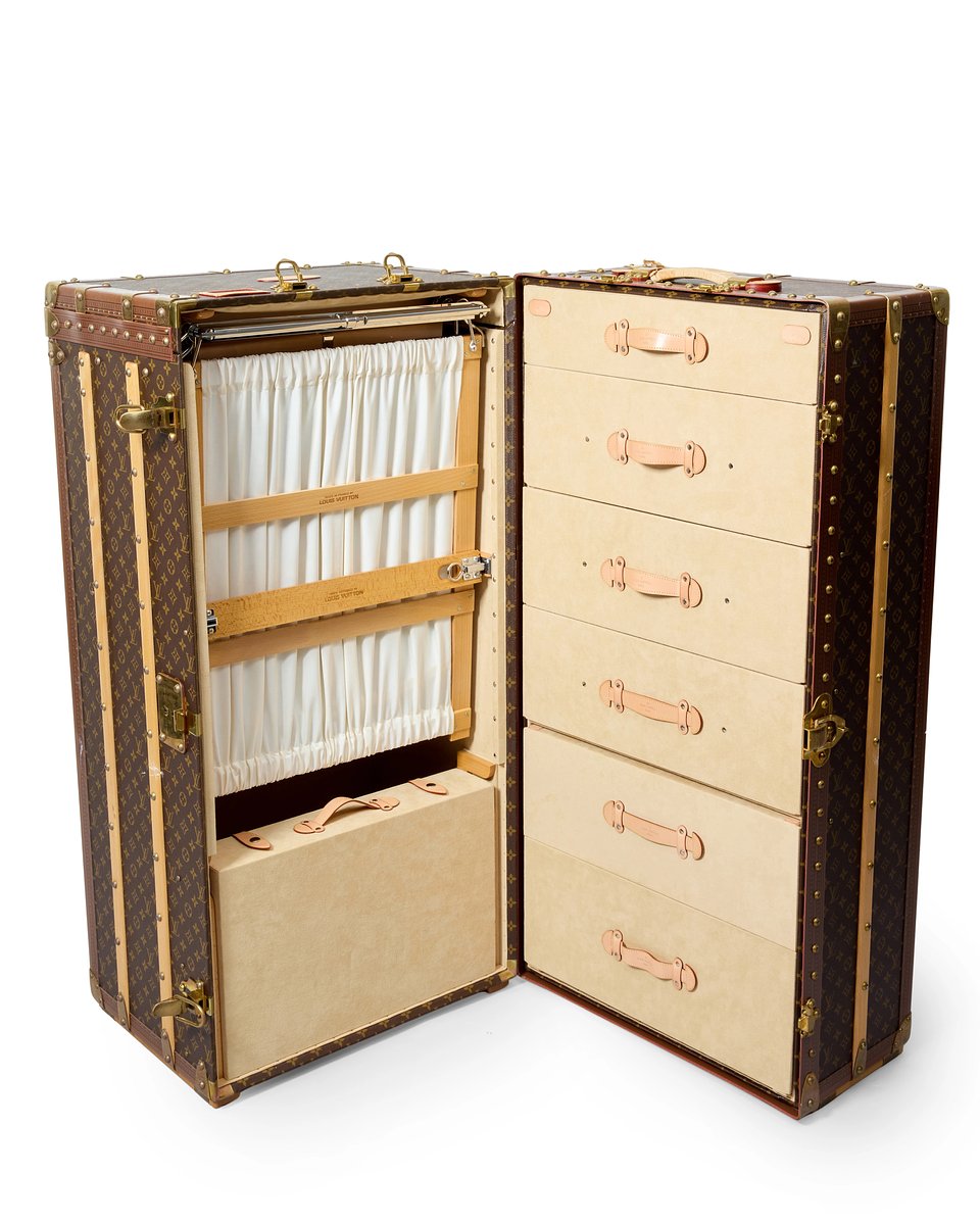 Lot 199: A modern Louis Vuitton monogrammed canvas wardrobe trunk, c.1990s, with two leather handles
Price Realised: £10,496