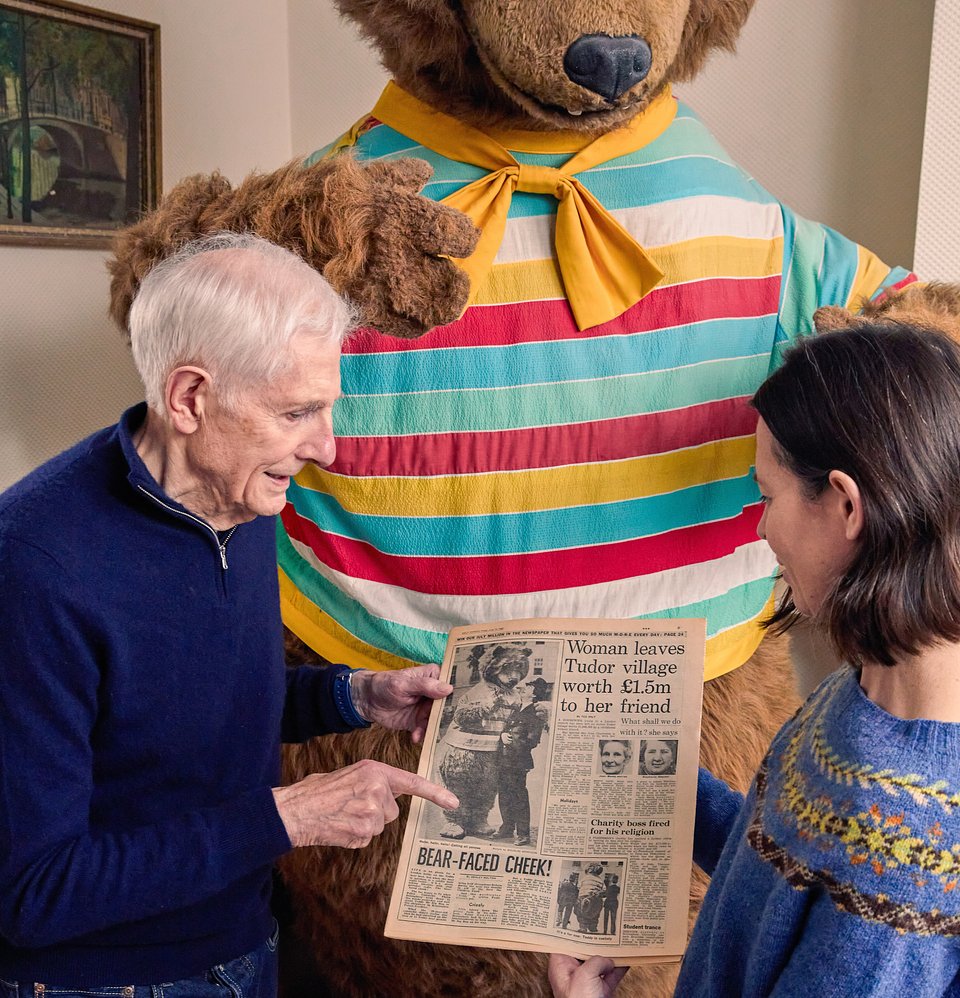 Stephen Marians shows Roseberys specialist Anna Evans the newspaper clipping of the photograph of the Bear with a policeman that possibly inspired the Koons sculpture