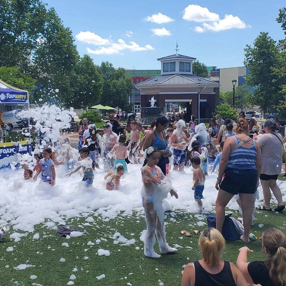 Kids dive into summer fun at the Foam Dance Party at The Shops at Perry Crossing, where laughter and bubbles fill the air. | Photo courtesy of The Shops at Perry Crossing