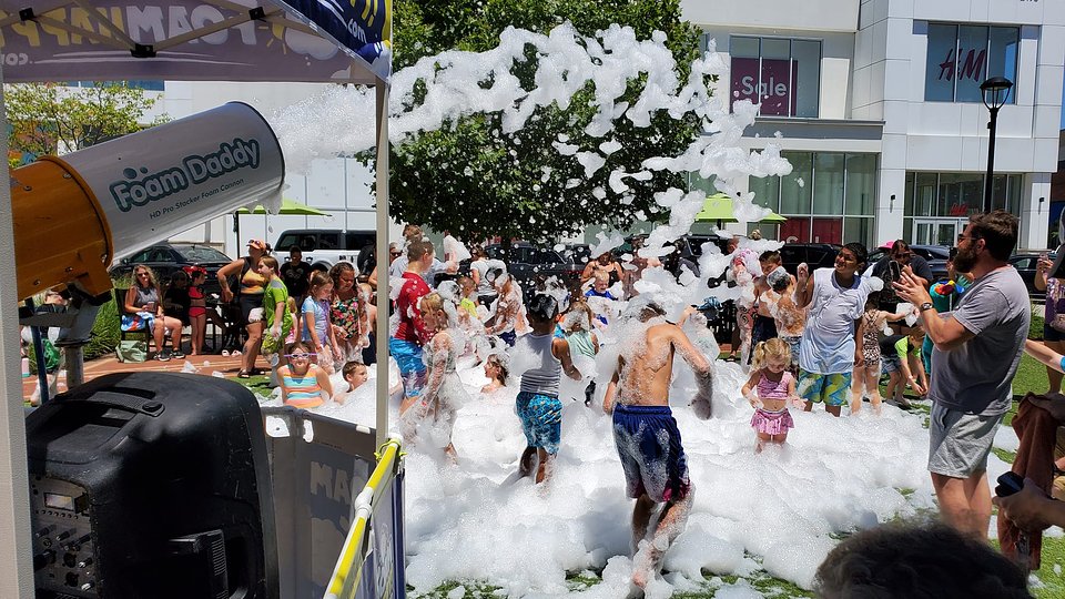 Groups of excited kids make a splash with foam and friends at The Shops at Perry Crossing’s popular summer event. | Photo courtesy of The Shops at Perry Crossing
