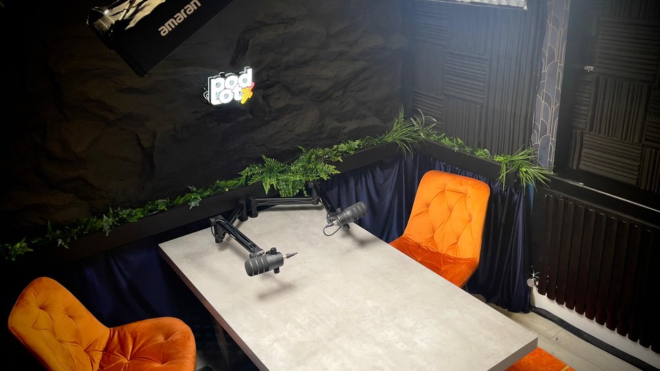 Podlot's studio features multiple setups and backdrops.