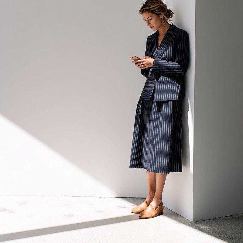 navy-pinstriped-skirt-suit-with-belted-blazer.jpg