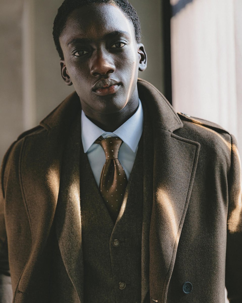 Brown long double-breasted overcoat with epaulettes