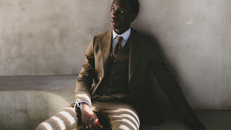 Brown long double-breasted overcoat with epaulettes