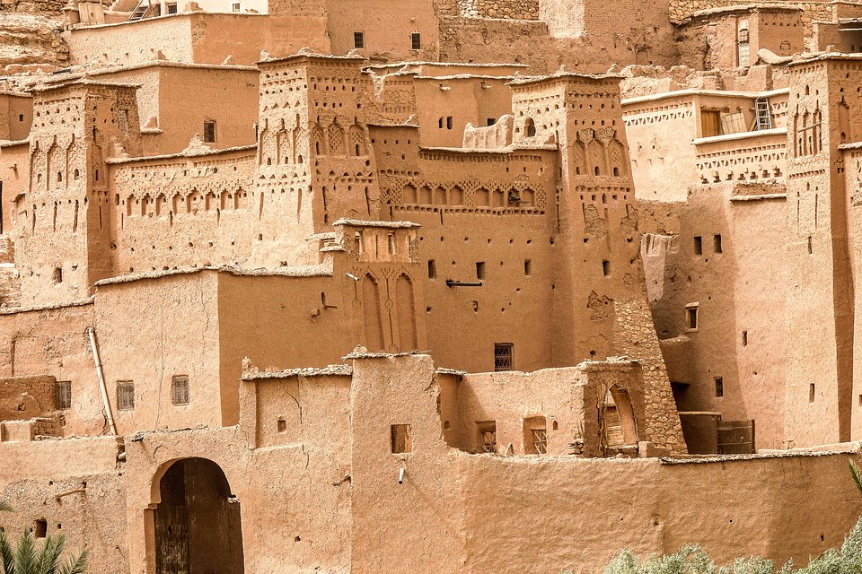 closeup-shot-buildings-made-concrete-sun-morocco.jpg