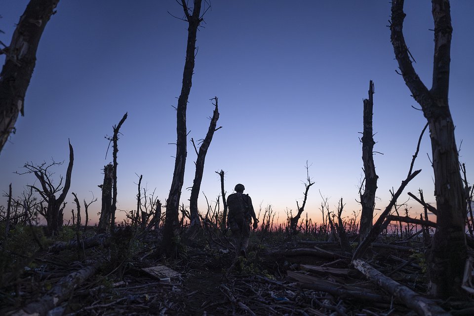 Ukrainian servicemen walk through a charred forest at the frontline a few kilometers from Andriivka, Donetsk region, Ukraine, Saturday, Sept. 16, 2023. Ukrainian brigade’s two-month battle to fight its way through a charred forest shows the challenges of the country’s counteroffensive in the east and south. 

© AP Photo/Mstyslav Chernov 