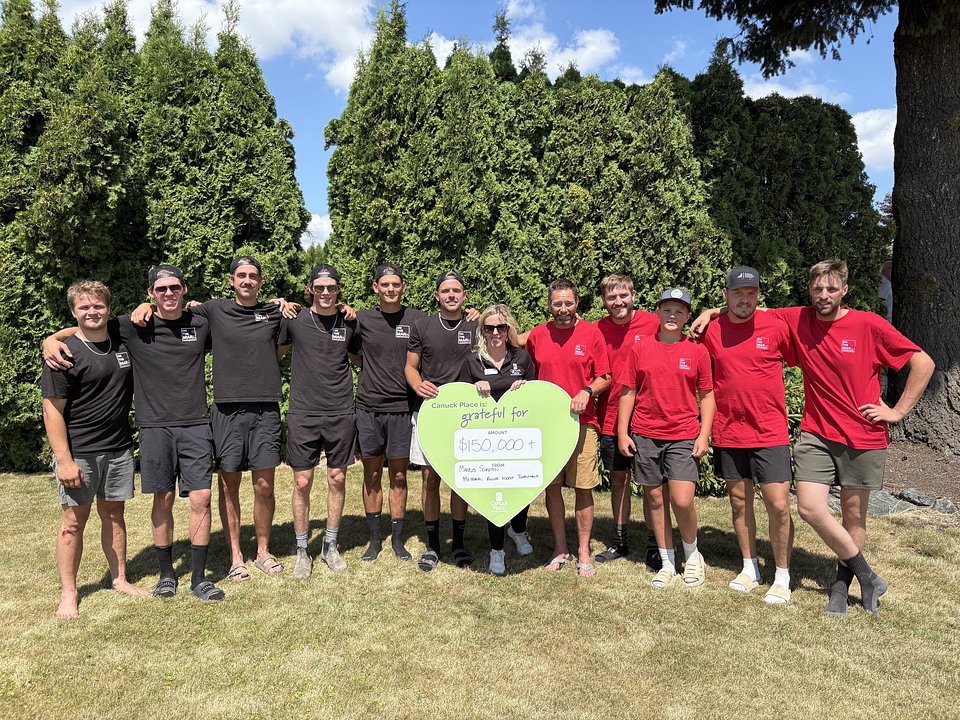 Markus' friends during a cheque presentation with Canuck Place