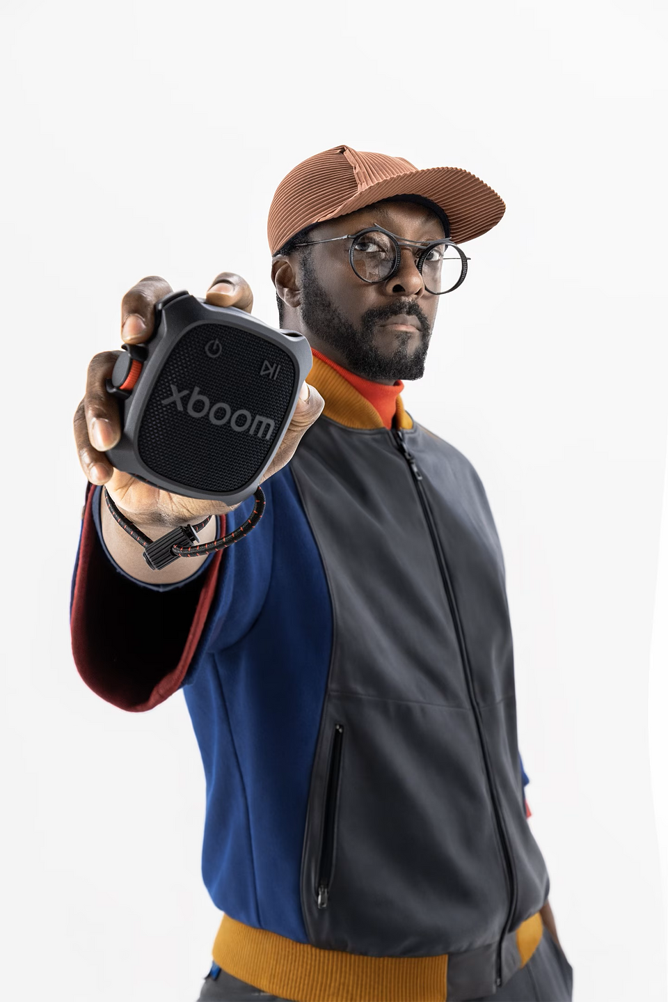 xboom Rock Black will.i.am holding.png