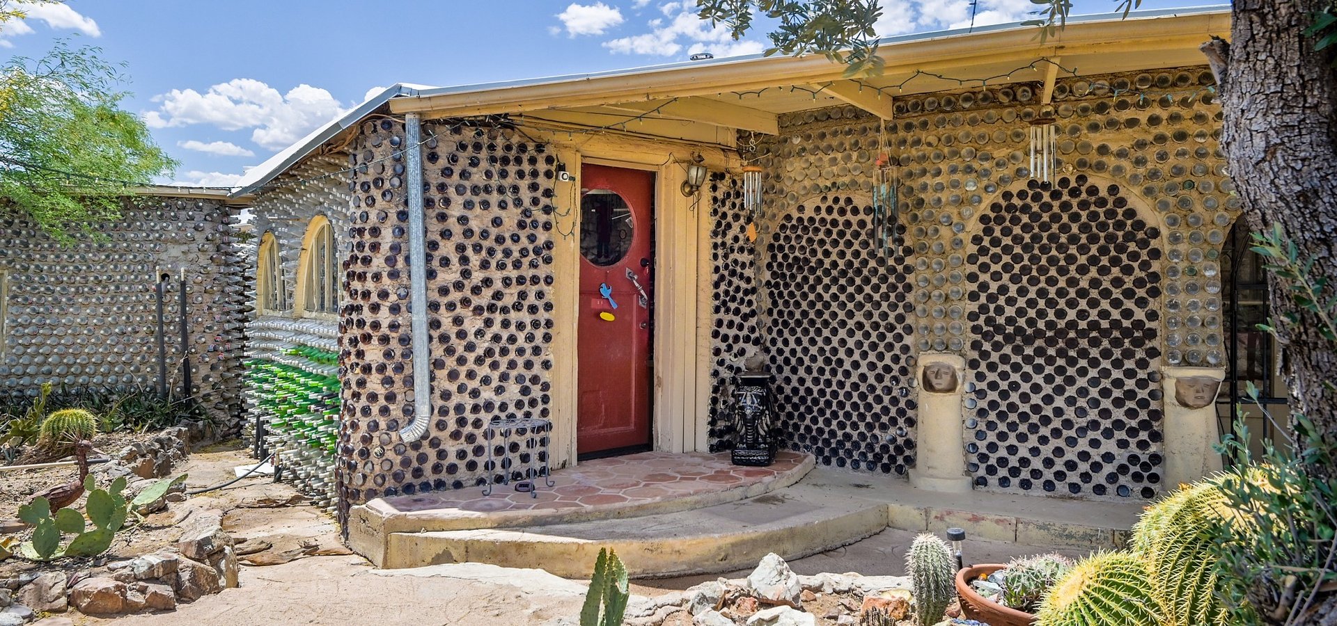 One-of-a-Kind Timeless Structure Built with Thousands of Glass Bottles Listed for $432,500 by Coldwell Banker Realty
