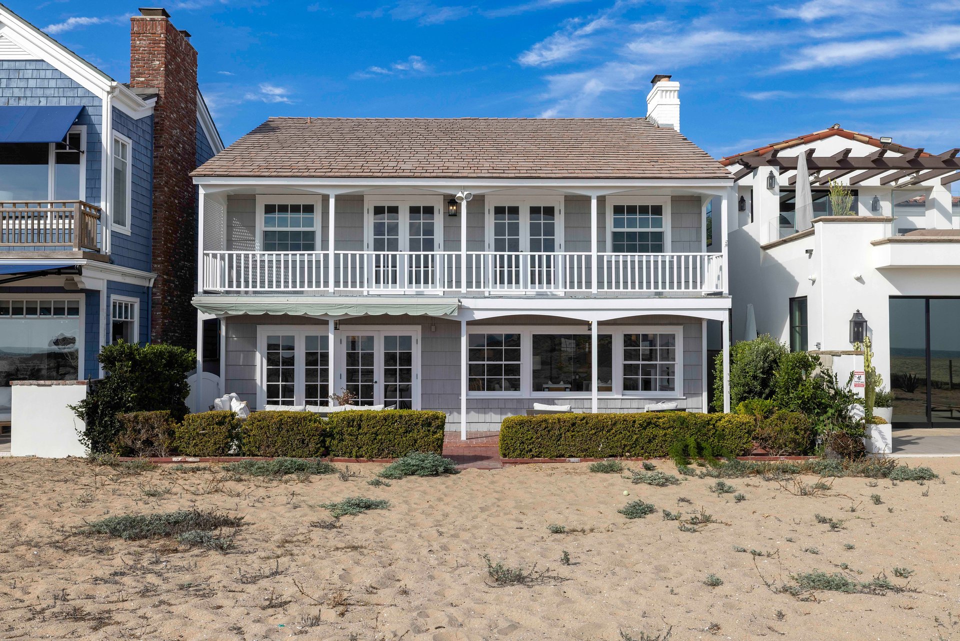Freshly Reimagined Nantucket-Style Residence on a Premier Oversized Oceanfront Lot Listed for $11,875,000 by Coldwell Banker Realty